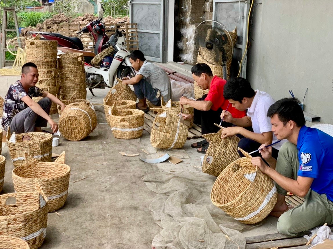 Artisans weaving baskets